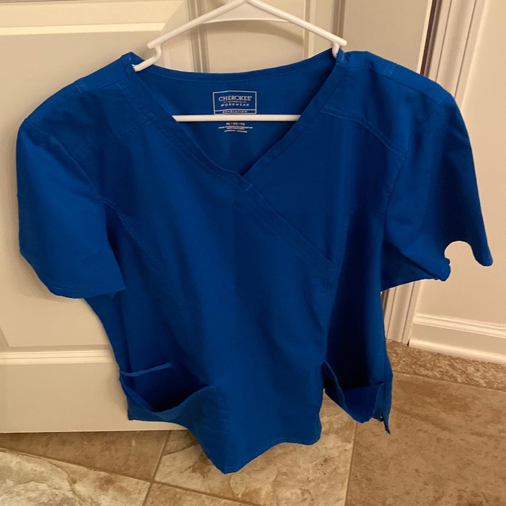 Blue Scrub top. Hardly worn due to change of career change.